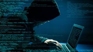 A hacker on a computer