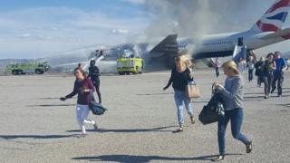 passengers fleeing burning aircraft