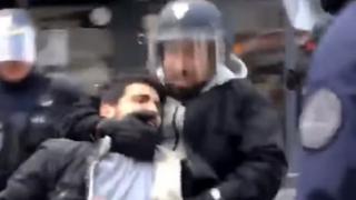 göstericiyi ve Macron'un koruması