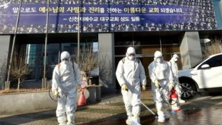 Workers spray disinfectant in front of the Daegu branch of the Shincheonji Church of Jesus, the Temple of the Tabernacle of the Testimony. Photo: 19 February 2020