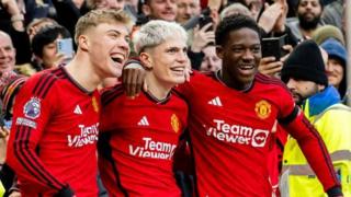 Manchester United players Rasmus Hojlund, Alejandro Garnacho and Kobbie Mainoo celebrate a goal against West Ham