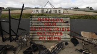 Remnants of Ms Plesman's home in front of parliament