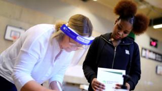 A student receives her GCSE results