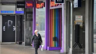 Woman wearing mask while shopping in Edinburgh