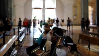 Key workers visiting the Sagrada Familia basilica in Spain wore masks