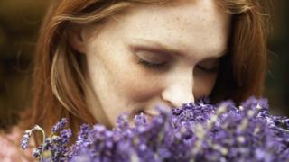 Woman smelling lavender