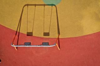 A children's playground lays dormant