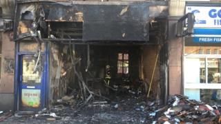 Burnt car inside shop