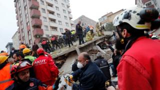 Rescue workers search for survivors at the site of a collapsed residential building in the Kartal district, Istanbul, Turkey, February 6, 2019