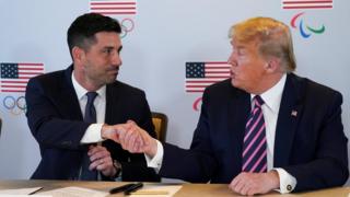 US President Donald Trump shakes hands with acting U.S. Department of Homeland Security Secretary Chad Wolf