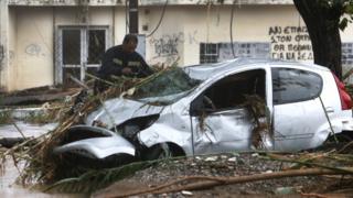 A car is destroyed after flooding caused by heavy overnight rain in Mihaniona, Greece, 7 September 2016