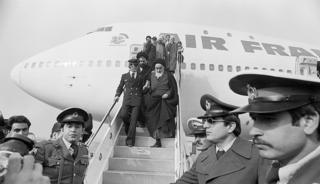 Ayatollah Khomeini and close companions getting off a plane