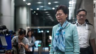 Carrie Lam (front)