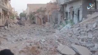 Screengrab of video released by IS news agency Amaq purportedly showing aftermath of air strike on Al-Bukamal, on Syria's border with Iraq