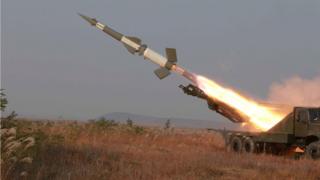 A rocket is fired during a drill by anti-aircraft units of the Korean People's Army