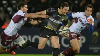 Dan Evans of Ospreys is tackled by Felix Le Bourhis