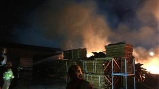 Timber yard on fire