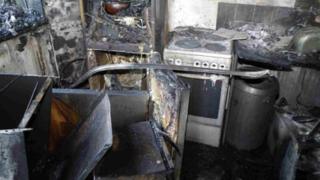 The burnt out kitchen where the Grenfell Tower fire started