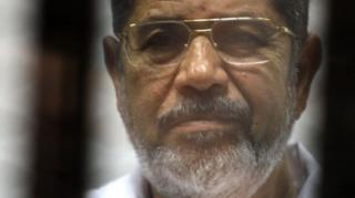 Morsi behind bars