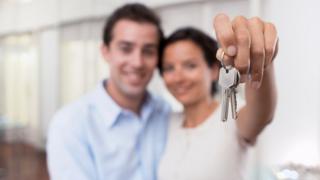 couple with house keys