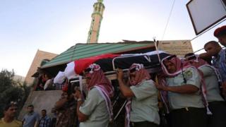 Jordanian soldiers carry coffin of comrade in Nahleh village after suicide bomb attack on border with Syria. 21 June 2016