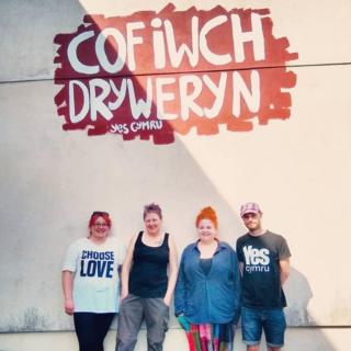 Sian Thomas-Ford and friends with her Tryweryn mural in Maesteg