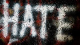 Graffiti reading 'hate'