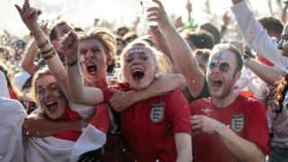 Fans celebrate Trippier's goal