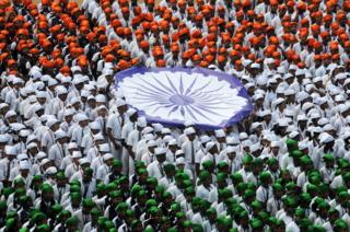 Indian school students form the national flag during an event to mark Republic Day in Chennai