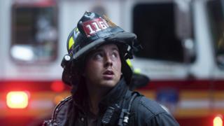 Firefighter looks up at the scene
