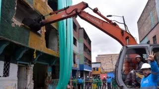 A demolition crew in Bogota's Bronx slum, 10 August