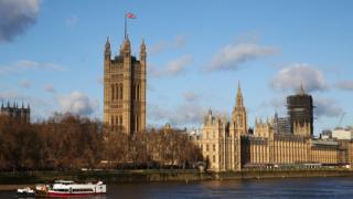 The Union Jack flying over Victoria Tower at the Houses of Parliament in London.