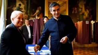 France's upcoming presidential primary election candidate of the right-wing party, Francois Fillon casts his vote at a polling station in Paris, Sunday, 27 November 2016, during the second round of the conservative primary election.