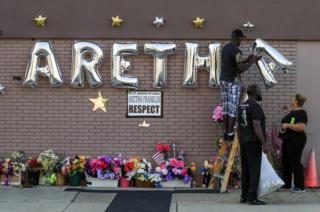People work on a memorial for US singer Aretha Franklin outside the New Bethel Baptist Church before her body arrives for a public viewing in Detroit, Michigan, on 30 August 2018.