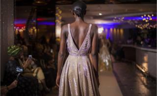 A model walking down the catwalk at the fashion show in Pullman Teranga Hotel during Dakar Fashion Week in Dakar, Senegal