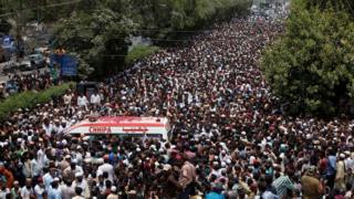 Thousands of people attend the funeral procession of Amjad Sabri