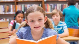Child in school library