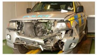 The front of the police vehicle was badly damaged in the incident