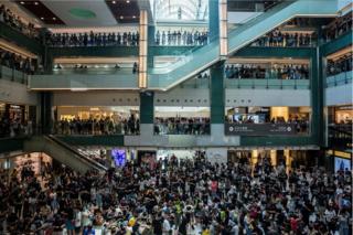 People gather at an anti-government rally inside a shopping mall at the Sha Tin district of Hong Kong on 22 September 2019