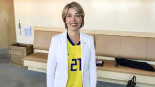 Annika Strandhall, Sweden's sports minister, at parliament wearing Sweden football shirt with Jimmy Durmaz's number