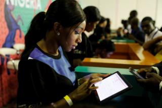 Youths are seen browsing the internet inside the venue of the launch of Google free wi-fi project in Lagos, Nigeria July 26, 2018.