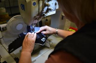 A woman at a sewing machine