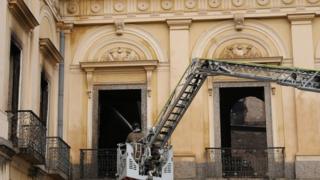 A firefighter sprays water at the National Museum of Brazil in Rio de Janeiro on 3 September 2018.