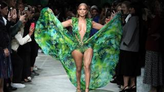 Jennifer Lopez, 50, closing the show at Versace in a recreation of her iconic green dress