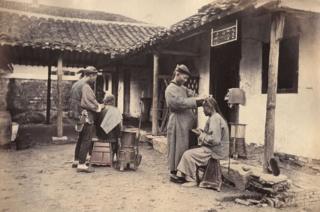 William Saunders, Itinerant Barbers, 1860s-1870s. Hand-tinted albumen silver print. No. 24 in Sketches of Chinese Life and Character series