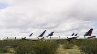 Decommissioned and suspended commercial aircrafts are seen stored in Pinal Airpark yesterday