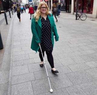 Dr Amy Kavanaugh walking along the street