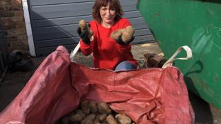 Susan Herdman holding potatoes