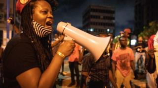 An activist shouts slogans in Accra, Ghana on June 6, 2020 during a protest against the death of George Floyd.