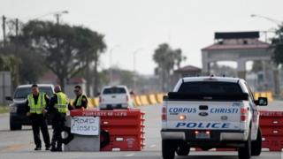 Police officers stand at a checkpoint after a shooting incident at Naval Air Station Corpus Christi, Texas, U.S. May 21, 2020